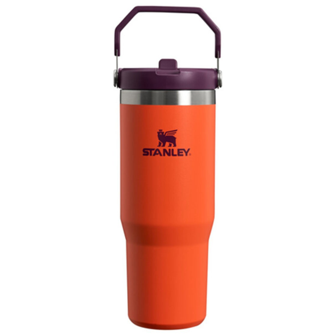 Stanley IceFlow 30oz Tumbler with an orange body, purple lid, and handle. It features a stainless steel rim and the Stanley logo on the side.