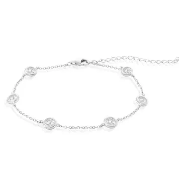 A silver bracelet with a delicate chain design features evenly spaced round charms, each set with a small sparkling stone, and includes an adjustable clasp for sizing.