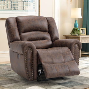 A brown leather recliner with nailhead trim is positioned in a living room setting, featuring a side table with a lamp and decorative items.