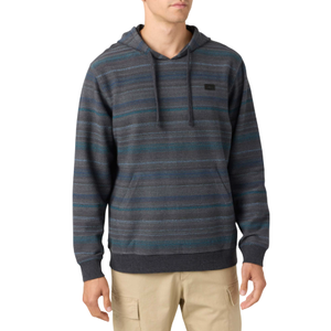 A man wearing a hooded, striped sweater with dark tones and beige cargo pants.