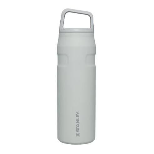 A white Stanley water bottle with a handle on the lid features a simple cylindrical design and subtle branding.