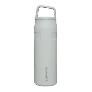 A white Stanley water bottle with a handle on the lid features a simple cylindrical design and subtle branding.