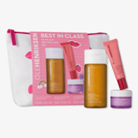 OLEHENRIKSEN \“Best in Class\“ skincare set includes three products: a cleanser (120ml/4fl.oz), serum (15ml/0.5fl.oz), and crème (12ml/0.4fl.oz), all housed in a white pouch with pink accents.