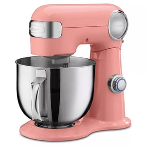 A pink stand mixer with a stainless steel bowl and adjustable settings knob.