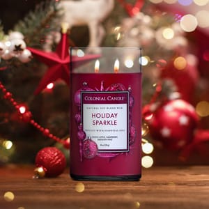 Colonial Candle Holiday Sparkle, featuring natural soy blend wax and essential oils, includes scents of green apple, raspberry, and Siberian pine, with a festive holiday background.