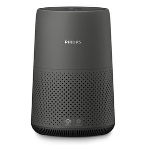 A cylindrical Philips HEPA air purifier with a dark gray exterior, featuring air intake perforations and branding on the front.