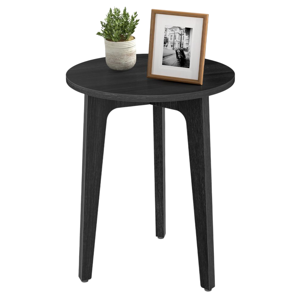 A round black wooden side table with three legs, featuring a potted plant and a framed black-and-white photo on top.