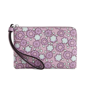 A wristlet with a pink floral pattern, featuring a zipper closure and a detachable strap.