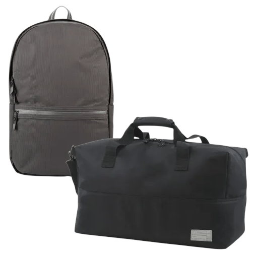 A gray backpack with a front zipper pocket and a black duffel bag with dual handles and a small label.