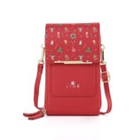 Red crossbody phone purse with festive holiday-themed patterns, gold hardware, and adjustable strap. Brand name \“LIOR\“ on front.