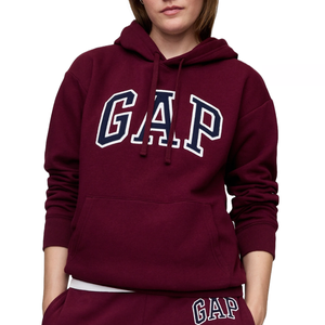 Maroon hooded sweatshirt featuring \“GAP\“ in large, bold white letters with navy blue outlines on the chest, complete with a kangaroo pocket and matching maroon drawstrings.