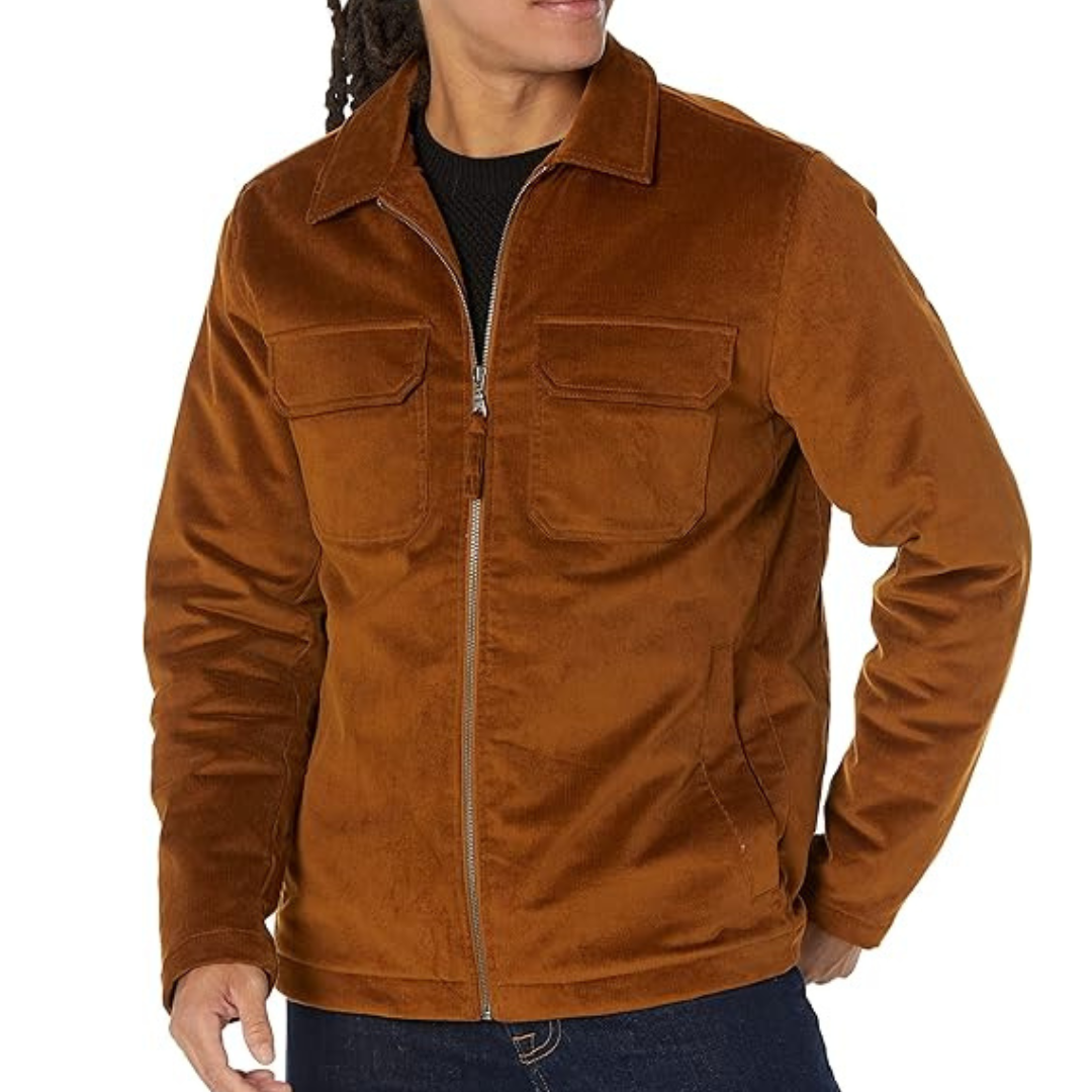 Brown zip-up jacket with a corduroy texture, featuring two chest pockets and a collared design. Worn over a black shirt paired with dark jeans.