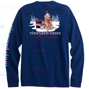 Navy long-sleeve t-shirt featuring a holiday-themed graphic with a dog wrapped in lights next to presents and the text \“vineyard vines HAPPY HOLIDAYS.\“