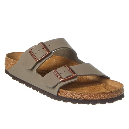 Birkenstock Arizona Sandals feature two adjustable straps with metal buckles, a contoured cork footbed for support, and an EVA sole. The design emphasizes comfort and durability, suitable for casual wear.
