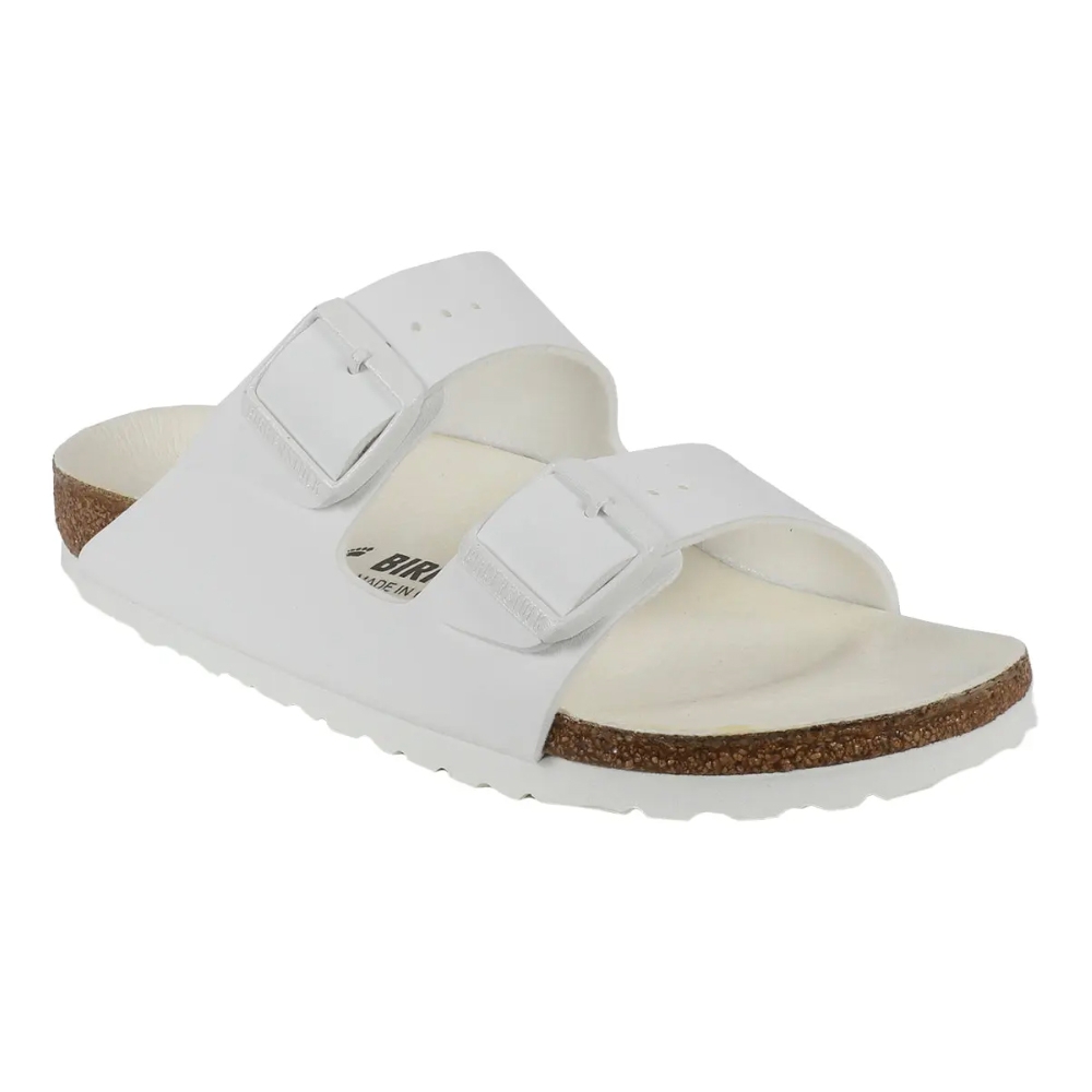 White Birkenstock sandal featuring two adjustable straps with buckles and a cork footbed.