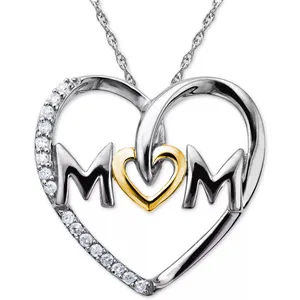 A heart-shaped \“Mom\“ necklace with silver and gold tones featuring embedded round clear stones on one side.