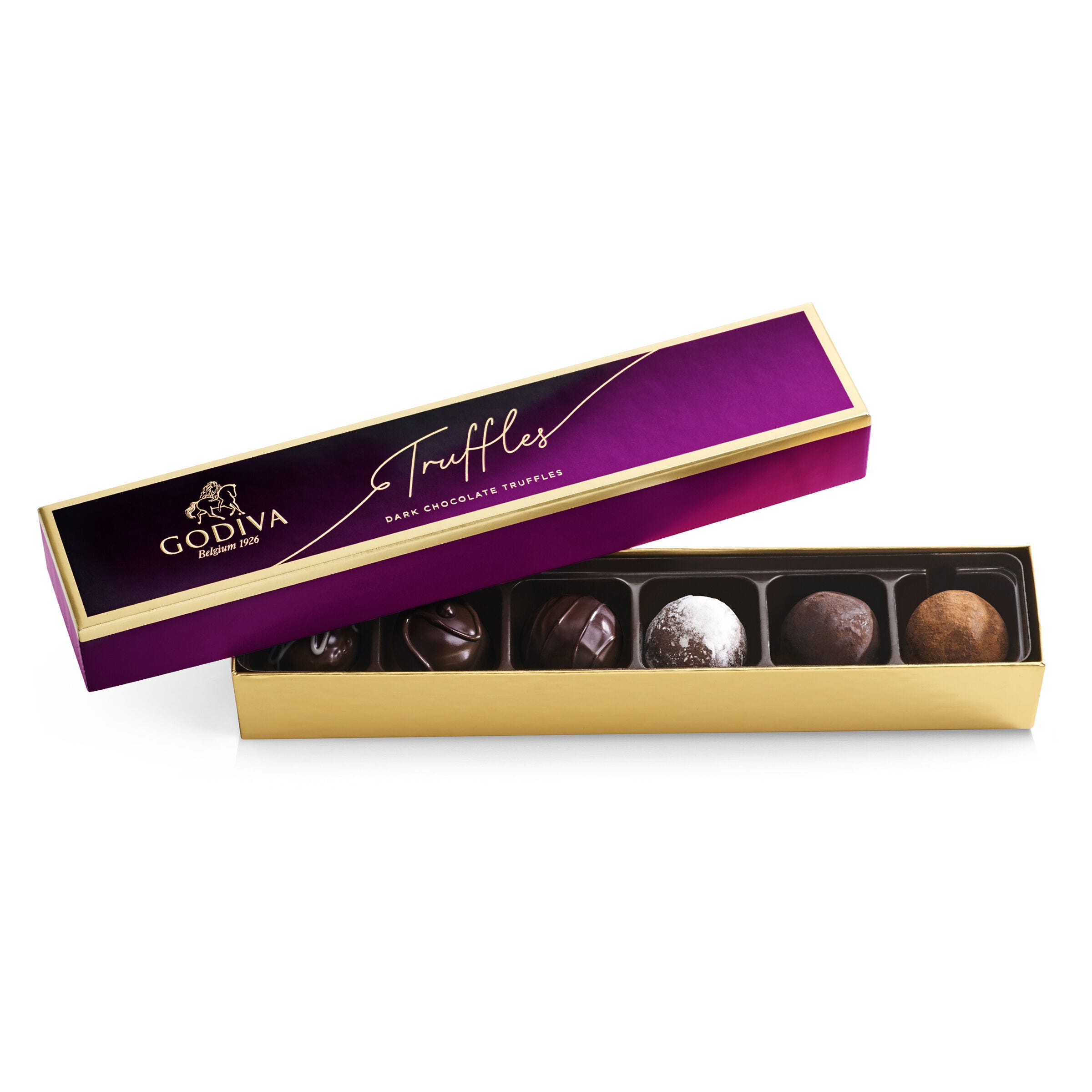 Godiva dark chocolate truffles in an elegant purple and gold box with a selection of assorted truffles inside.