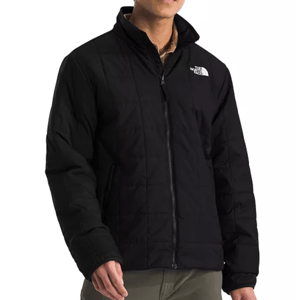 The North Face Junction Jacket is a black, quilted jacket with a high collar and zip front. It features the brand's logo on the chest and has side pockets, offering a sleek, functional design suitable for colder weather.
