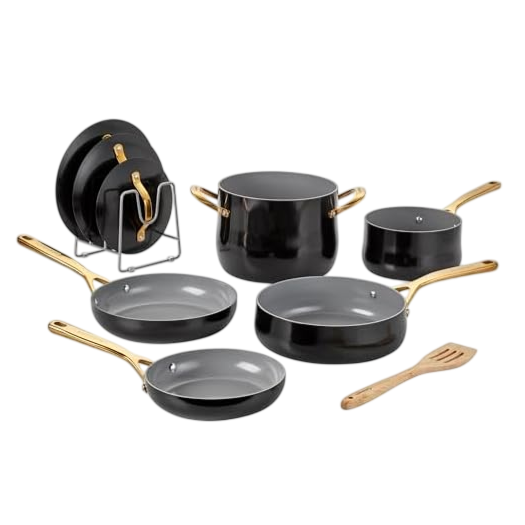 Cookware set with black non-stick pots and pans featuring gold handles, a wooden spatula, and a metal rack for organization.