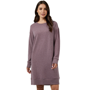 A woman is wearing a long-sleeved maroon sweater dress.