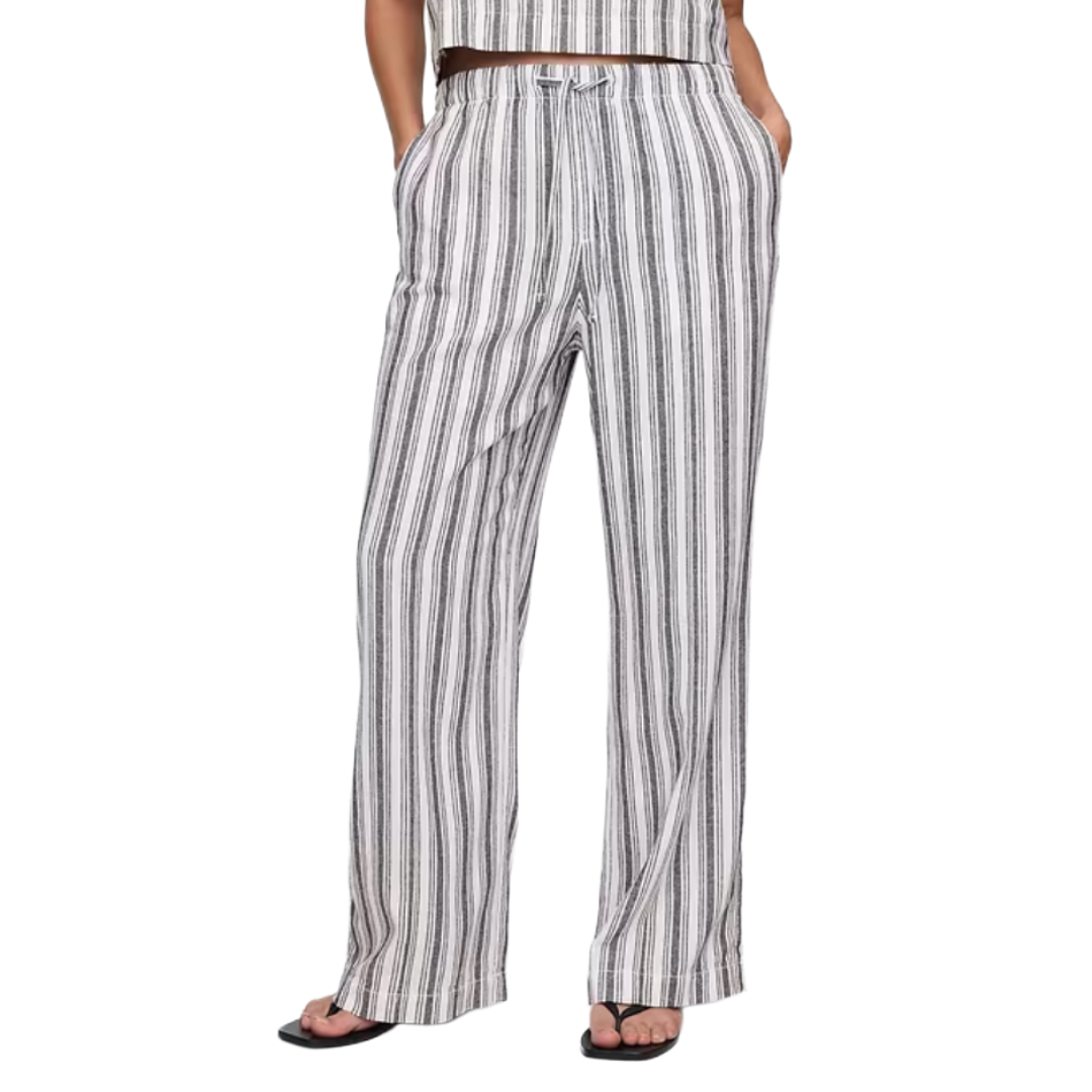 Striped wide-leg pants with a drawstring waist, featuring vertical black and white stripes.