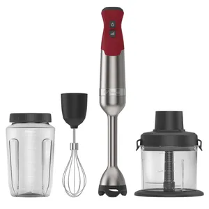 A Vitamix immersion blender set with various attachments: a red and stainless steel hand blender, whisk attachment, blending jar with lid, and a food processor container.