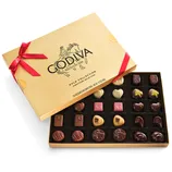 A Godiva Gold Collection chocolate box contains an assortment of 30 chocolates, elegantly packaged with a red ribbon.