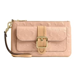 A beige wristlet clutch with a decorative buckle on the front pocket, featuring embossed patterns and a detachable wrist strap with a gold clasp.
