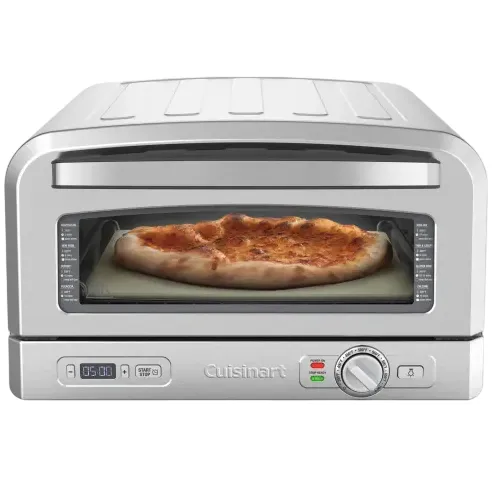 Countertop pizza oven with a pizza inside.
