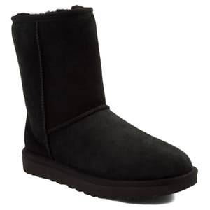 Women's UGG Classic Short II Boots in black feature a mid-calf design with a sheepskin lining and a suede exterior. They have a Treadlite by UGG sole for comfort and traction.