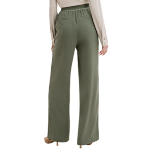 A person is wearing olive green, wide-leg pants with an elastic waistband and two back pockets, paired with a long-sleeve, cream-colored blouse with buttoned cuffs.