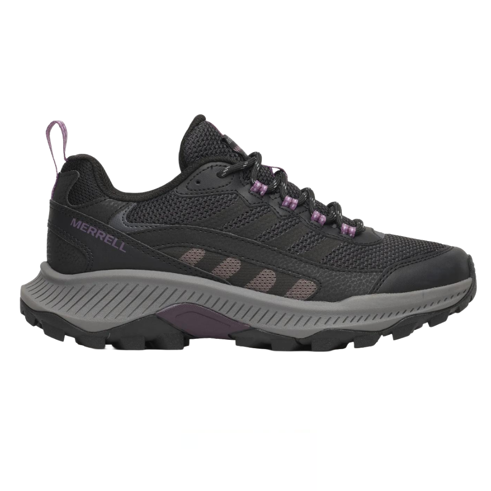 A black and dark gray Merrell hiking shoe with a textured mesh upper, purple accents, and a thick, rugged sole designed for outdoor trails.