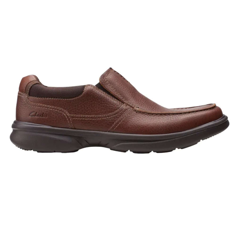 Brown leather slip-on shoe from Clarks with a durable, cushioned sole and visible stitching.