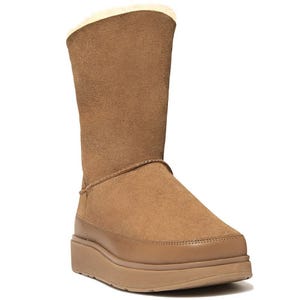 A brown suede winter boot with a thick sole and fluffy interior lining.