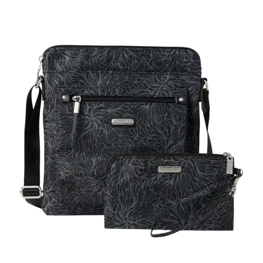 Black crossbody bag and pouch set with a floral pattern, featuring zippers and a detachable strap.