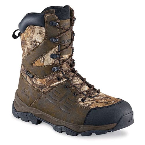 A camo-patterned hunting boot with high ankle support, rugged sole, and lace-up design, suitable for outdoor activities.