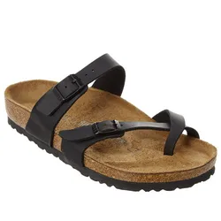 Black two-strap sandal with adjustable buckles, featuring a cork footbed and a textured rubber sole.