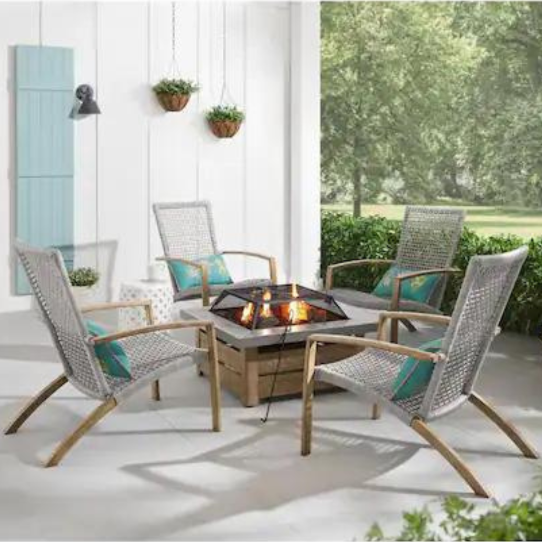 A patio set with four woven chairs and a central fire pit table.