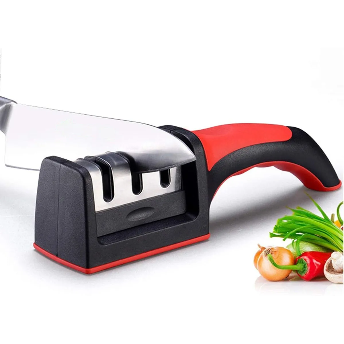 A knife sharpener with a red and black handle, featuring two slots for sharpening, placed beside sliced vegetables and herbs.