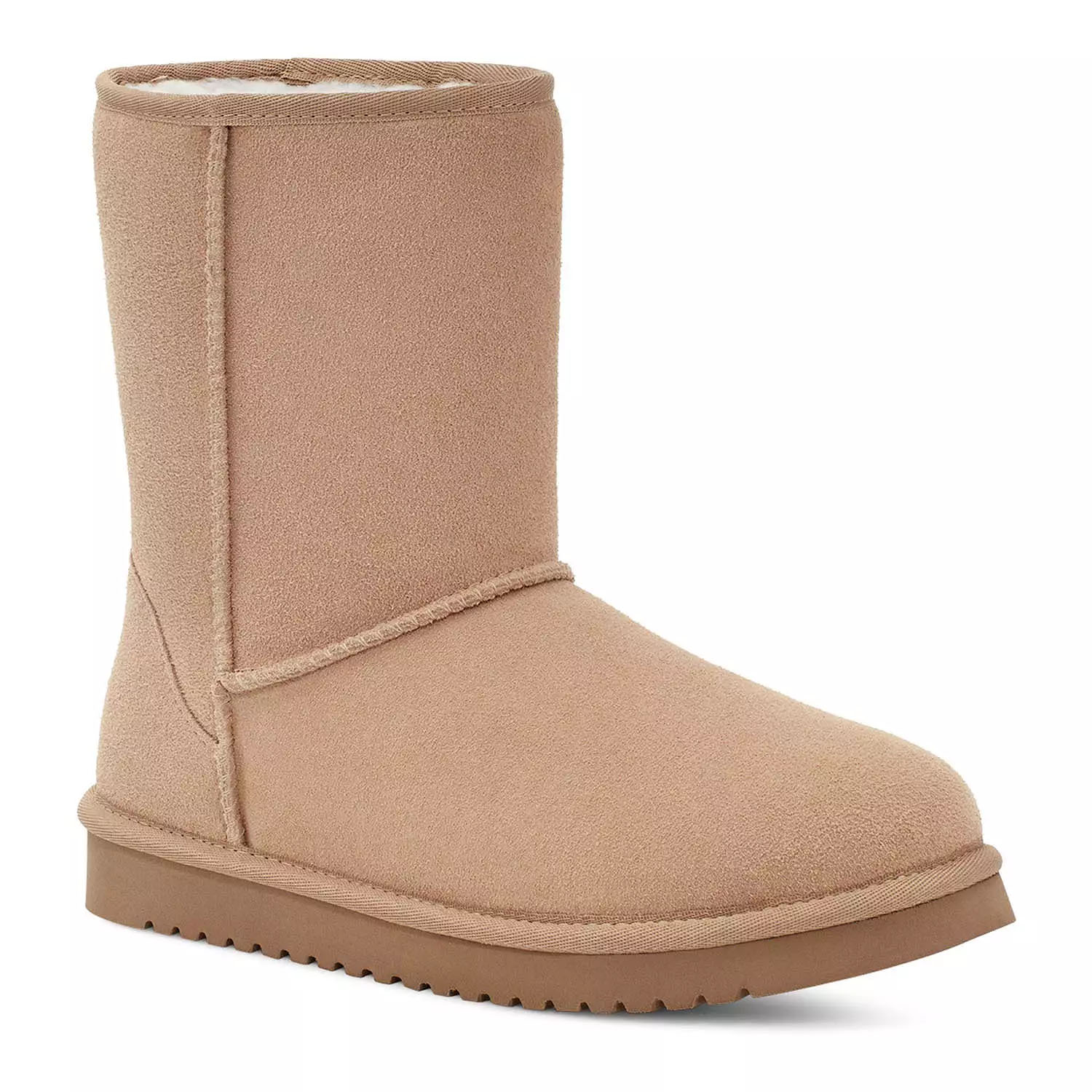 Tan mid-calf boots with a plush lining, structured stitching, and a flat rubber sole. Designed for comfort and warmth.