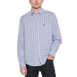 A man is wearing a Brooks Brothers long-sleeve button-down shirt with a light blue and pink checkered pattern, featuring a subtle logo on the chest. He's paired it with dark jeans.