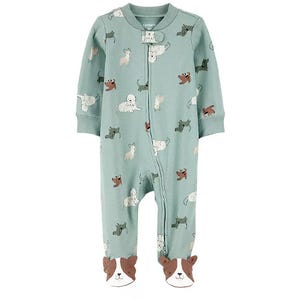 A green baby onesie with a zip closure features playful dog patterns and has footies designed to look like dog faces.