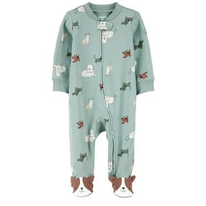 A green baby onesie with a zip closure features playful dog patterns and has footies designed to look like dog faces.