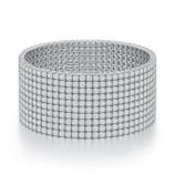 A wide, silver-toned bracelet featuring a grid design with small, square embellishments covering its surface.
