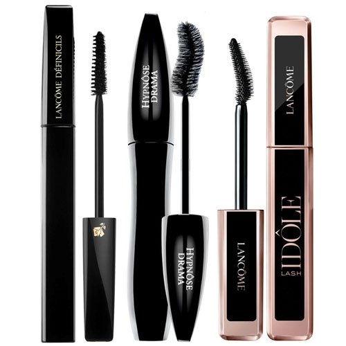Three full-size Lancôme mascaras, each with different brush designs for varying lash effects, are displayed with the wands removed for viewing.