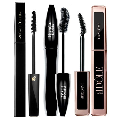 Three full-size Lancôme mascaras, each with different brush designs for varying lash effects, are displayed with the wands removed for viewing.