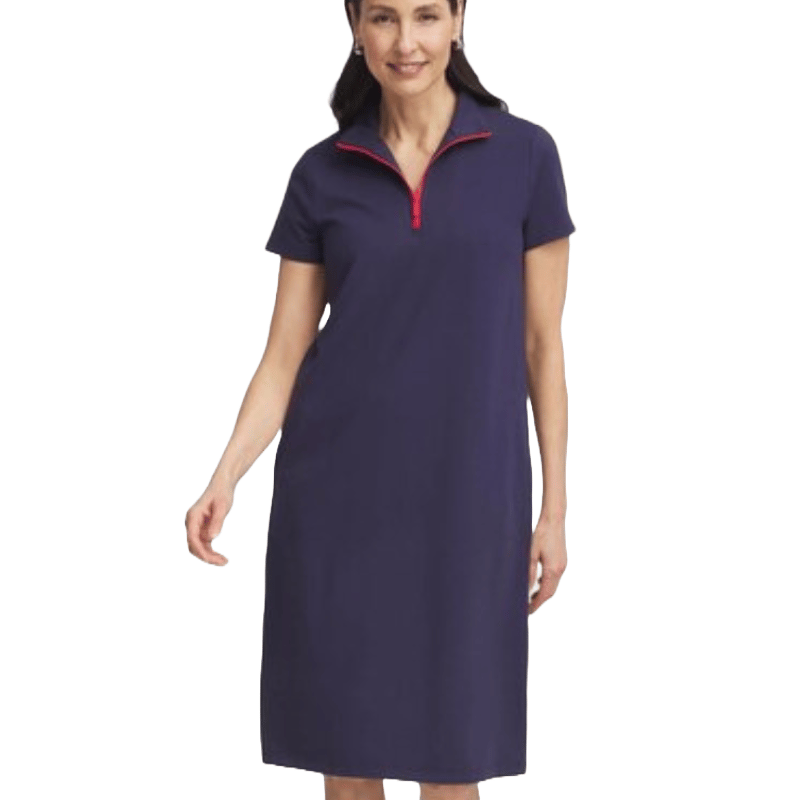A woman is wearing a knee-length, short-sleeve, navy blue dress featuring a half-zip front with a red zipper.