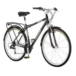 A black Schwinn hybrid bicycle with front suspension, fenders, a rear rack, and multiple gears.