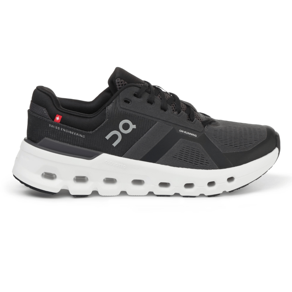 Running shoe with black mesh upper, branded \“On Running.\“ Features include Swiss engineering, white CloudTec sole with visible cushioning, and lace-up closure.