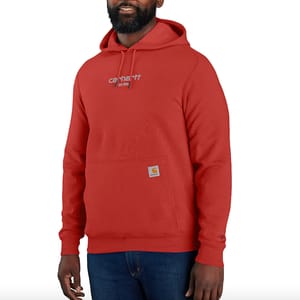 A man wearing a red hooded sweatshirt with a small logo on the pocket.